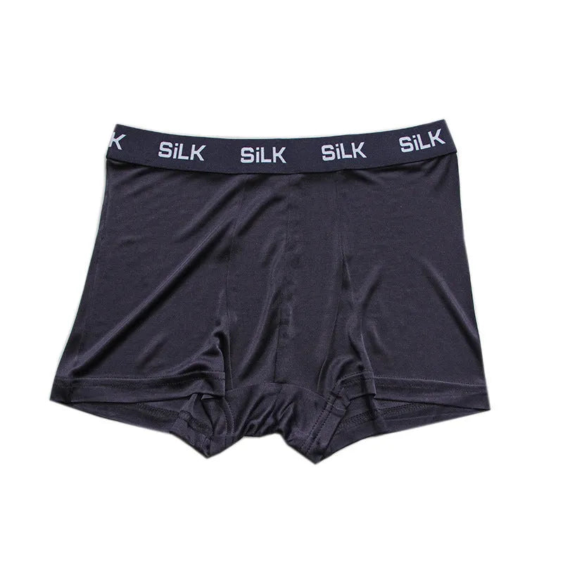 Men's navy blue silk shorts with mid-waist design on hanger