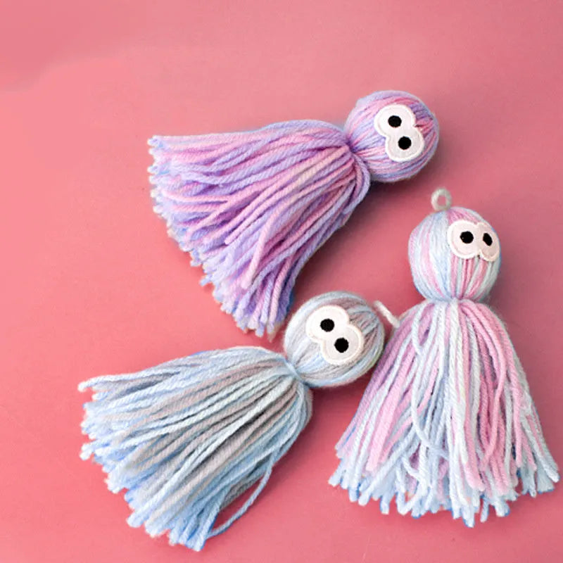 Wool ball cat toy in pink and blue colours with hanging attachment