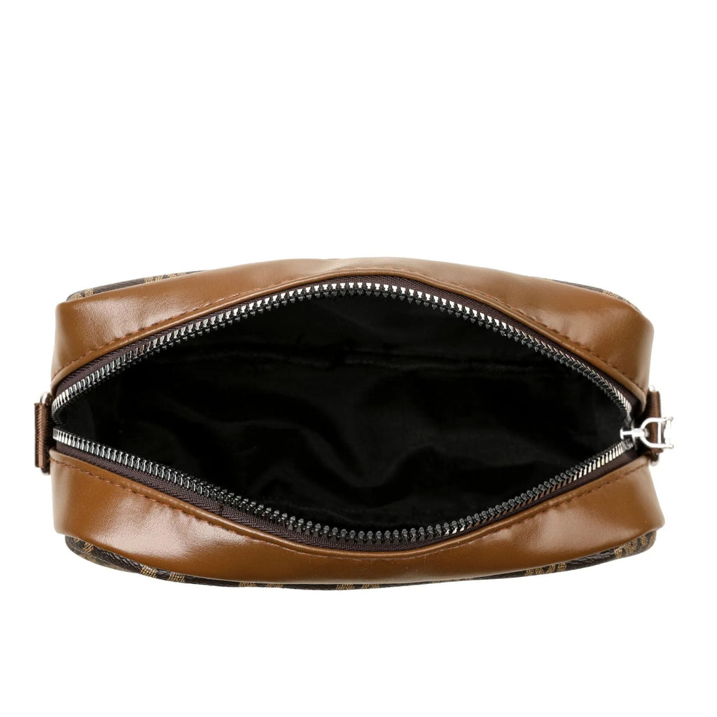 Black crossbody bag with wide strap and a three-dimensional front pocket.