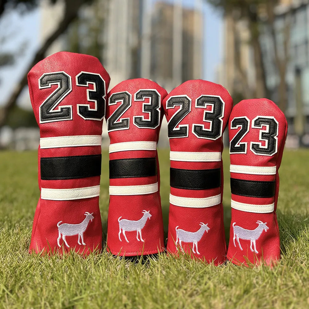 Set of coloured chicken drumstick design golf club head covers for fairway woods, a square putter, and irons.