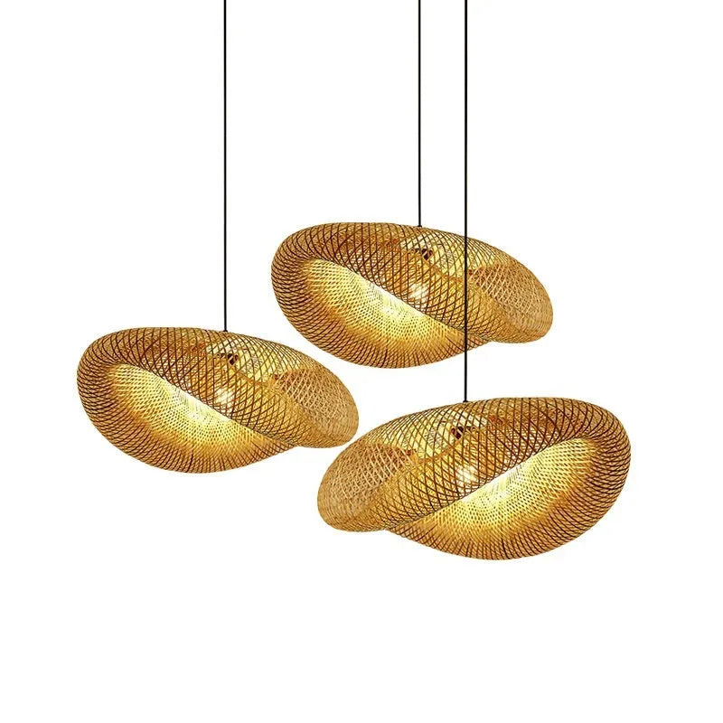 Natural bamboo straw hat-shaped pendant lamp shade hanging from a ceiling, showing its woven texture.