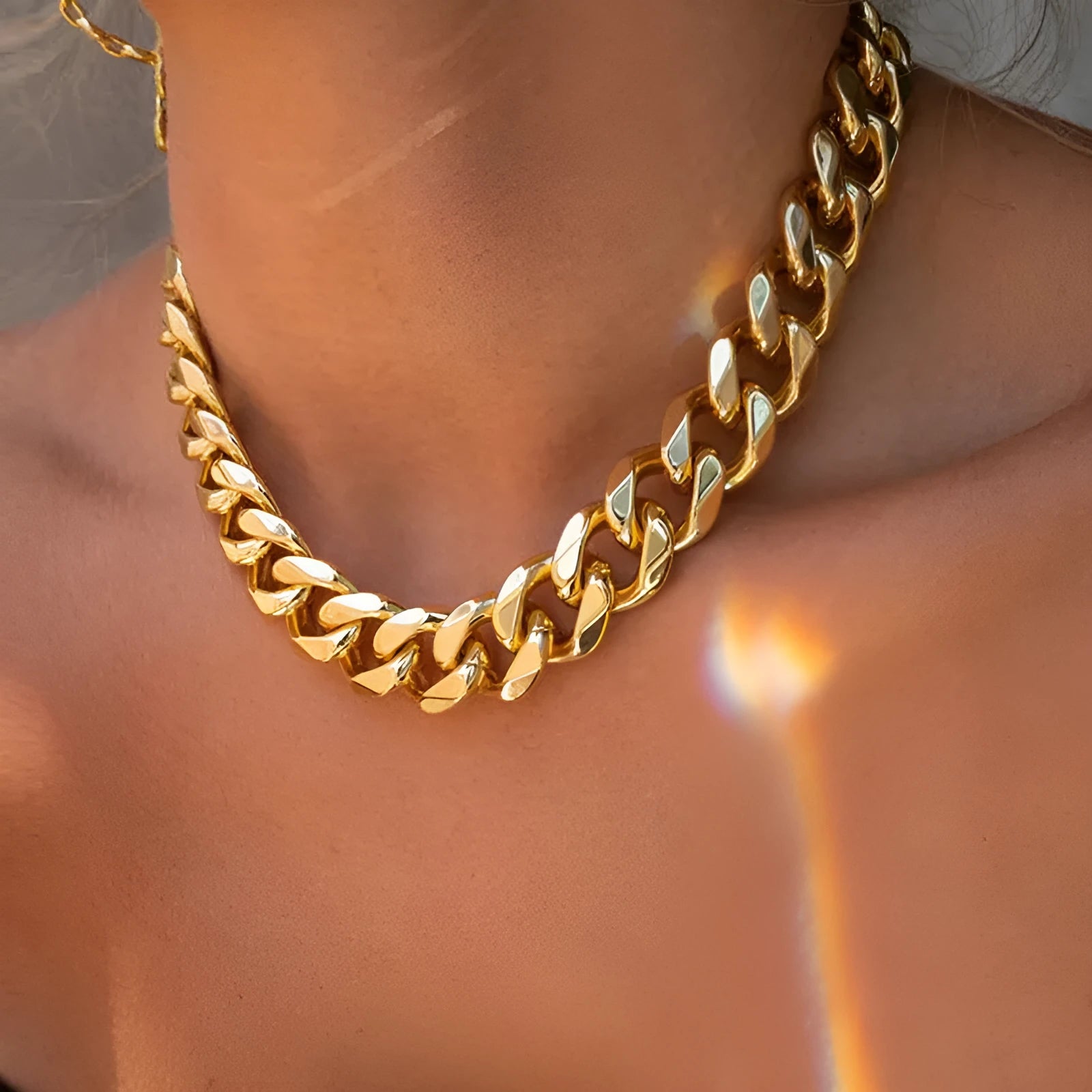 Gold thick chain necklace for women with a simple solid colour design.