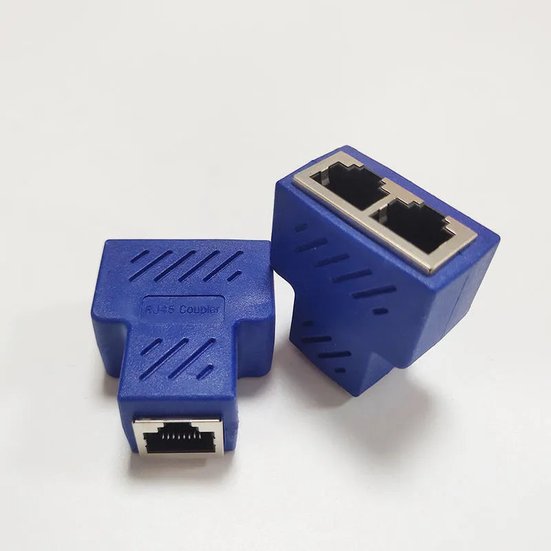 White RJ45 three-way network cable splitter adapter on a black background.