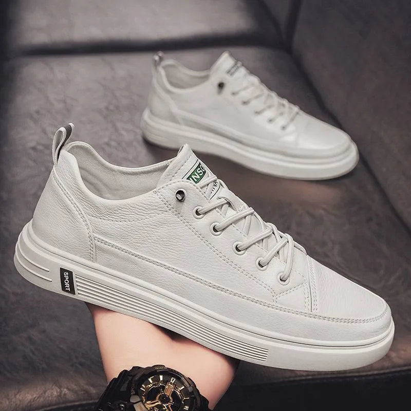 Men's white casual flat shoes with round toe and PU upper on a plain background