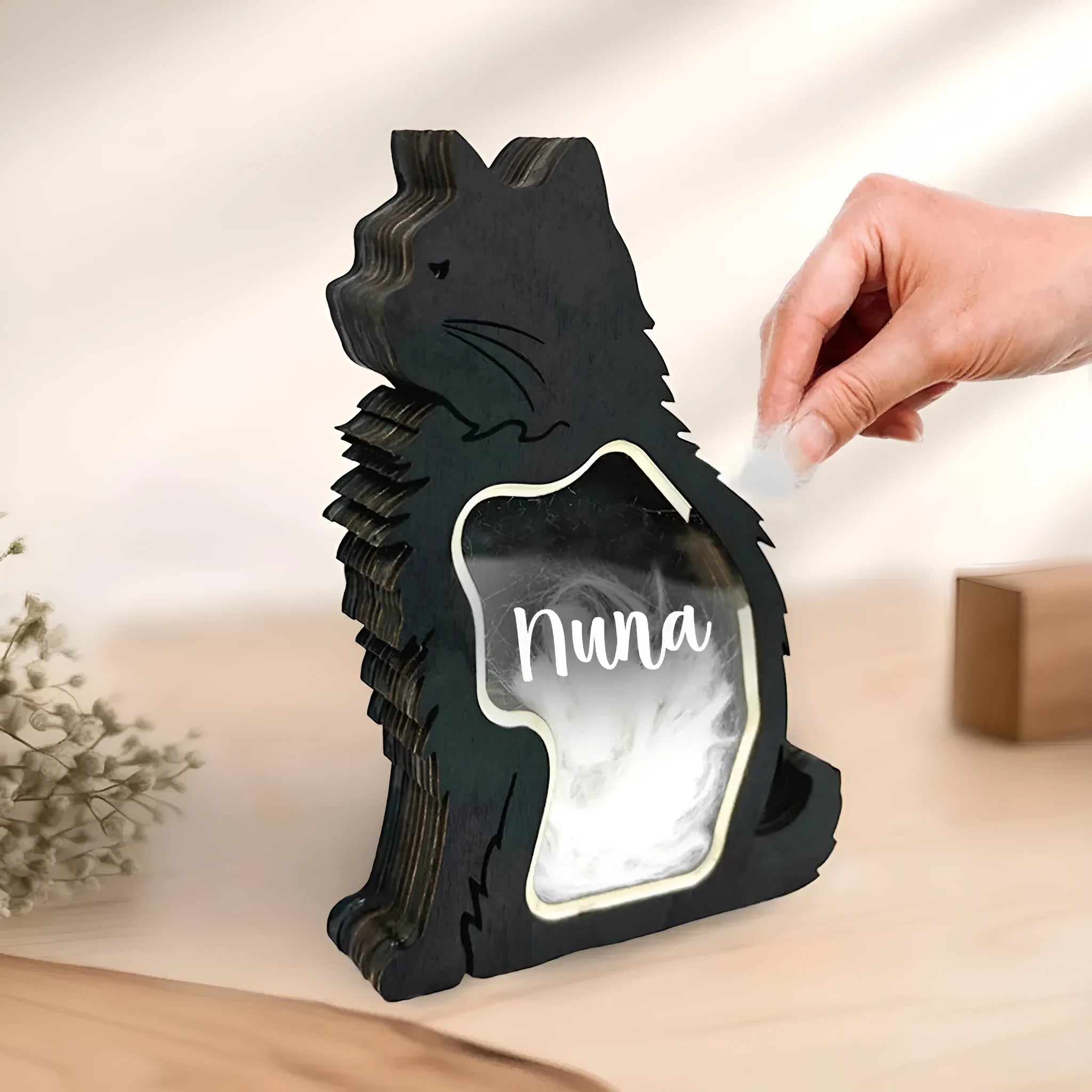 Black wooden pet hair storage box for organising grooming tools and accessories.