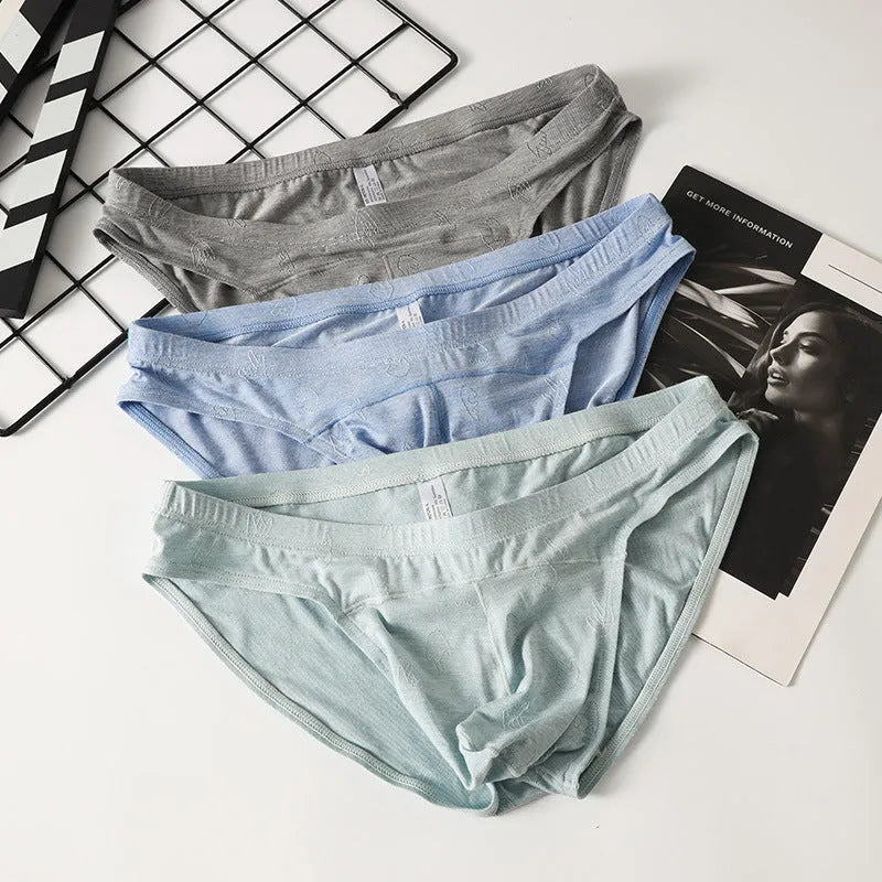 Modal low waist jacquard briefs in colourful blue on a grey background.