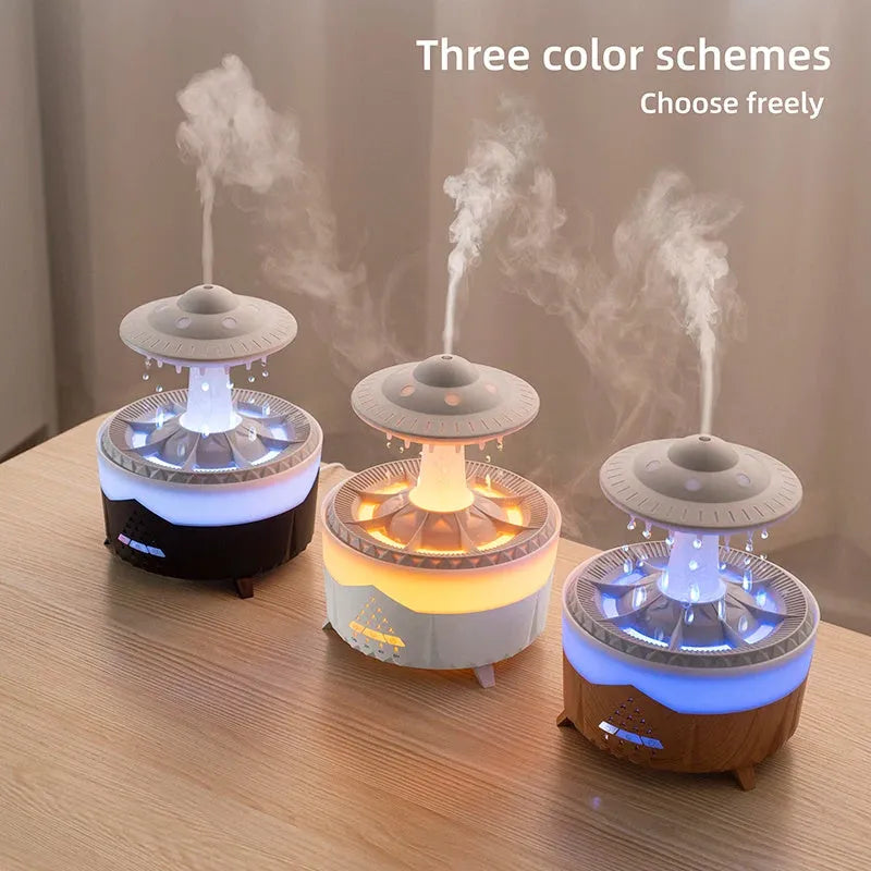 White cloud-shaped humidifier with raindrop mist and coloured night light on wooden table