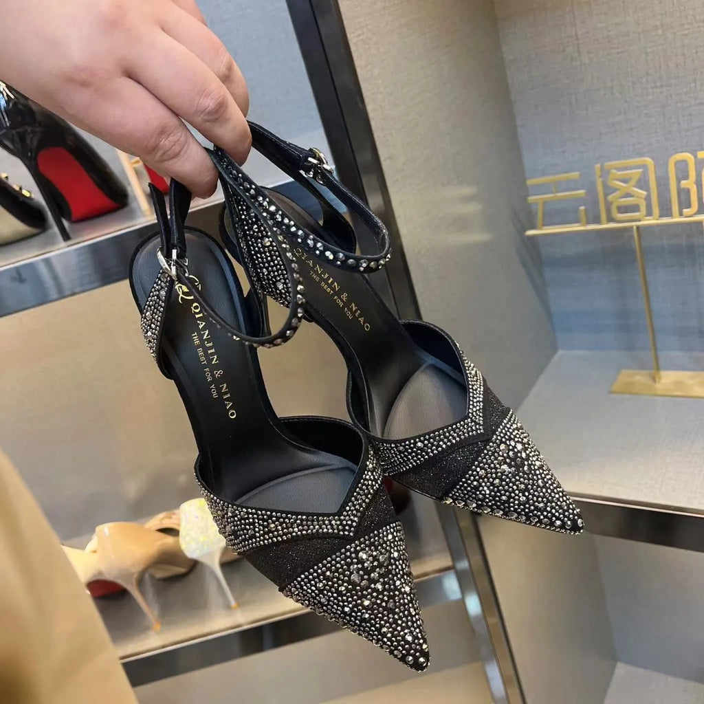 Women's black pointed-toe stiletto high heels with a hollow heel and red sole
