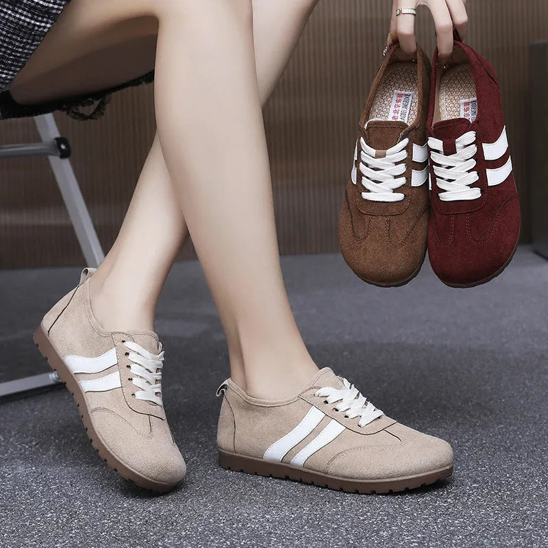Women's vintage canvas sneakers in dark red, maroon, and khaki with round toe and flat rubber sole.