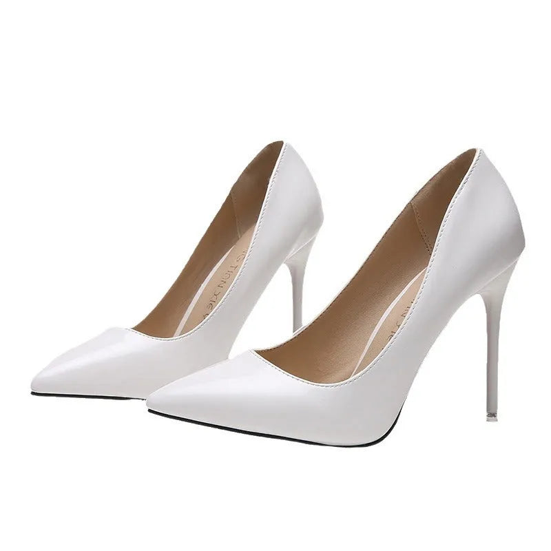 Women's pointed toe stiletto heel pump in apricot colour with a buckle detail on a rubber sole.