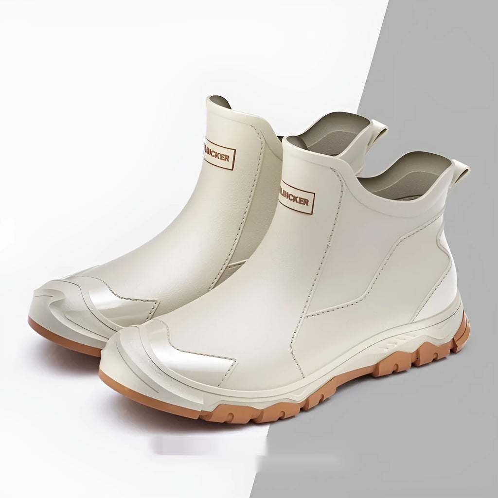 Low-cut short tube rubber rain boots in black with non-slip plastic soles.