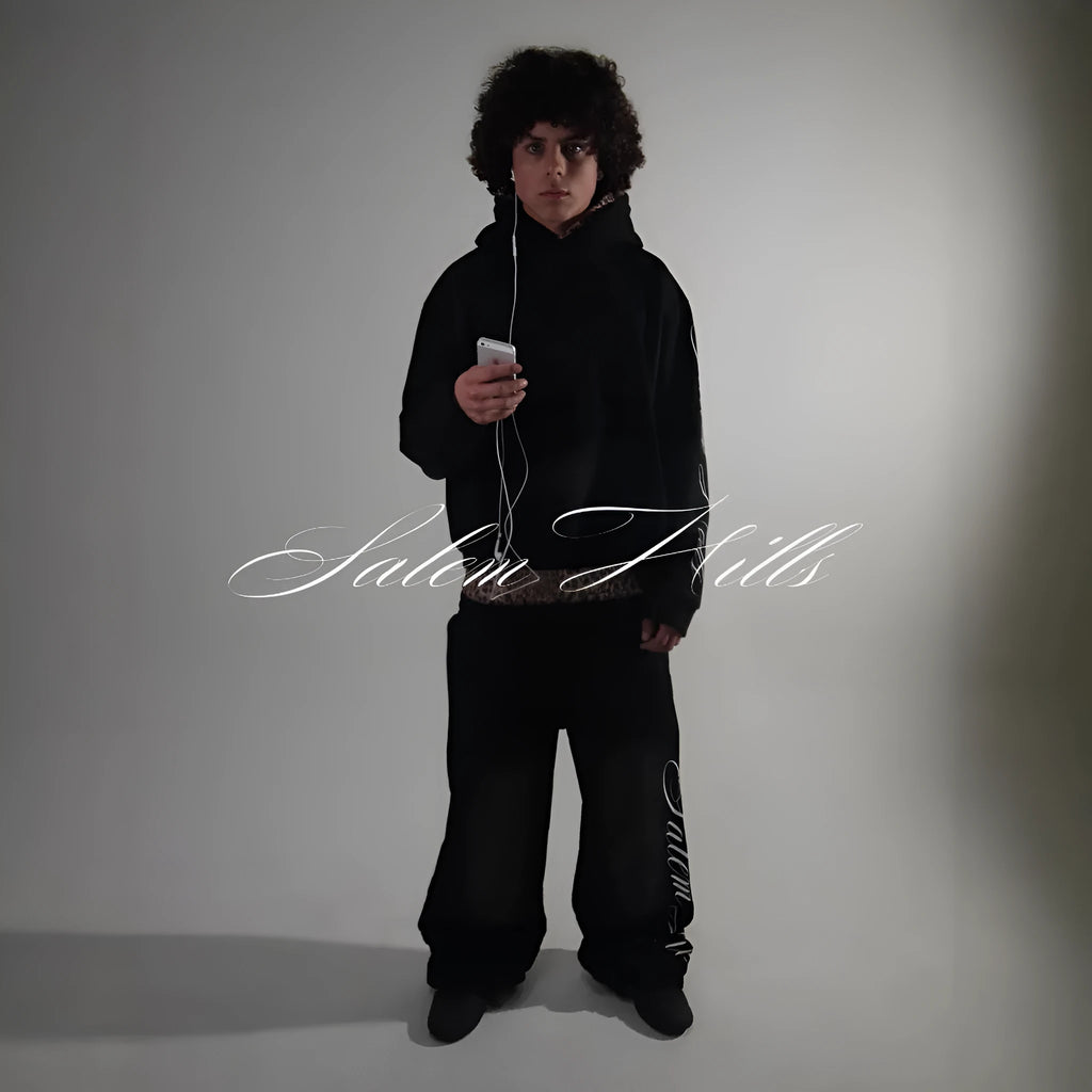 Adult male punk print hoodie and pants leisure suit set in fleece-lined polyester.