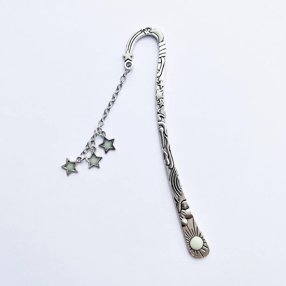 Retro five-pointed star metal bookmark glowing with celestial sun moon stars design