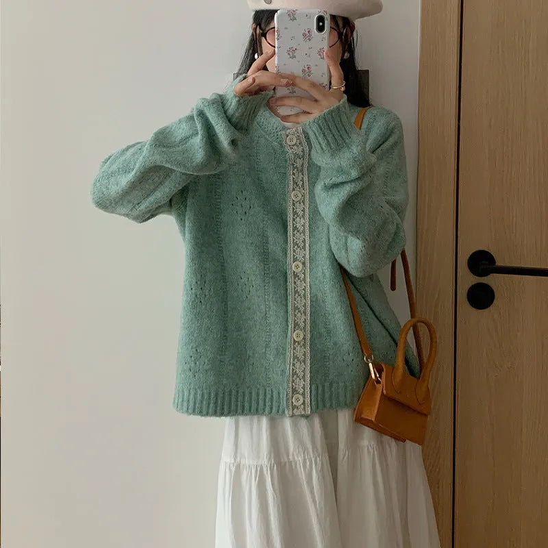 Loose fit artistic retro cardigan in viscose fibre shown in apricot colour.
