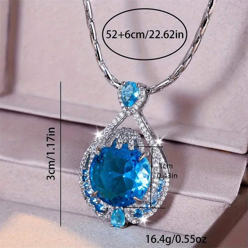 Geometric women's necklace with blue fireworks-cut crystal gems on a water wave chain.