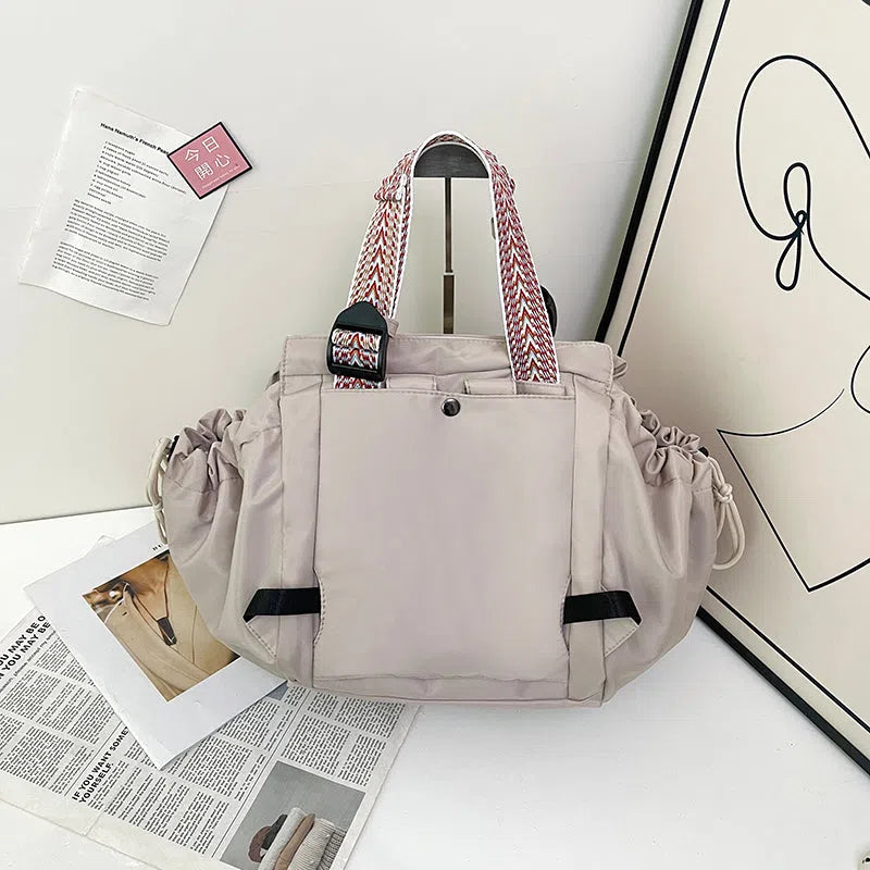 Nylon mommy bag in large capacity tote style, available in multiple colours for travel and daily use