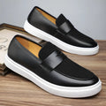 Black men's slip-on casual shoes with tassel detail, round toe and rubber sole