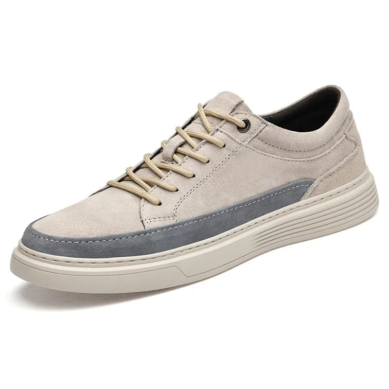Men's grey pigskin leather low-top casual skate shoes with a round toe and rubber sole on a white background.
