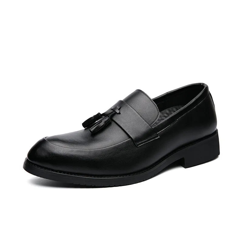 Men's black slip-on business casual shoes with a tassel detail on the front.