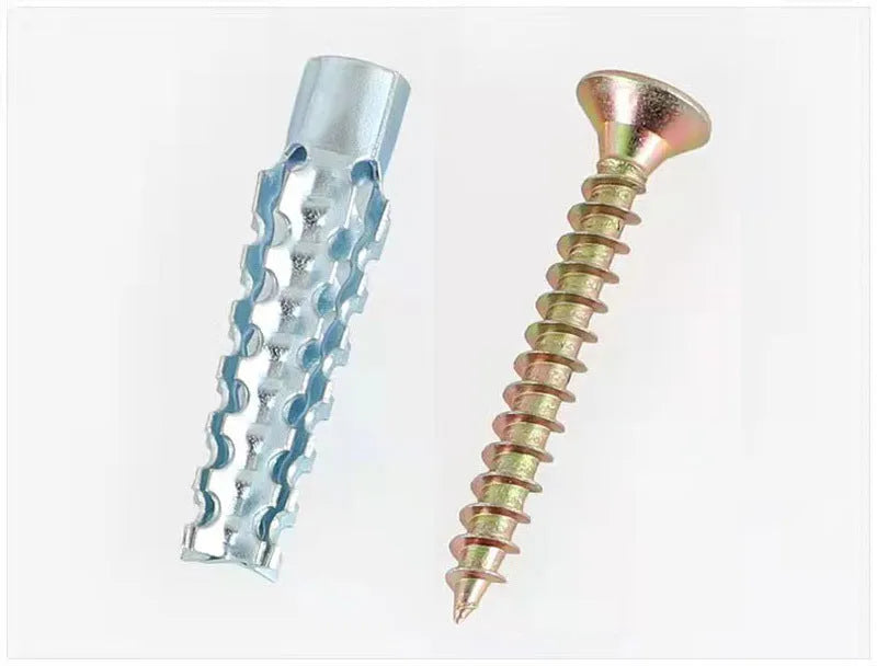 Metal expansion anchor with barbed serrated tube and screw for concrete and brick walls.