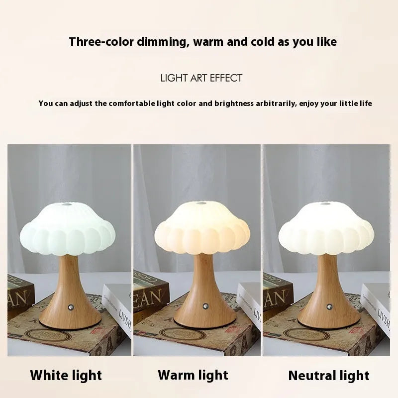 Touch control mushroom night light in wood grain colour on its wireless charging pad.