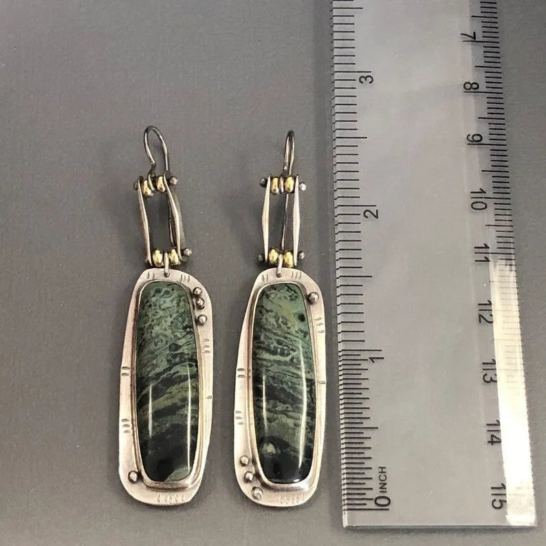 Geometric alloy earrings with two-colour marble pattern and simple styling