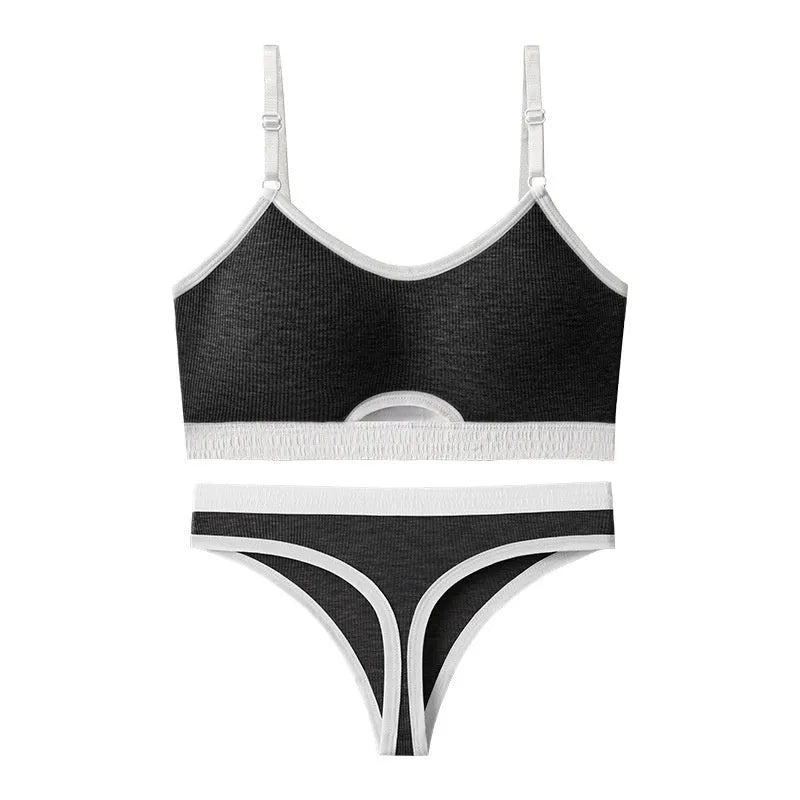 Women's black sports bra and panty set with underwire, moulded cups, and contrast colour back detailing.