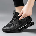 Black mid-top running shoes with mesh upper, leather stitching, and buckle closure on a rubber EVA sole.