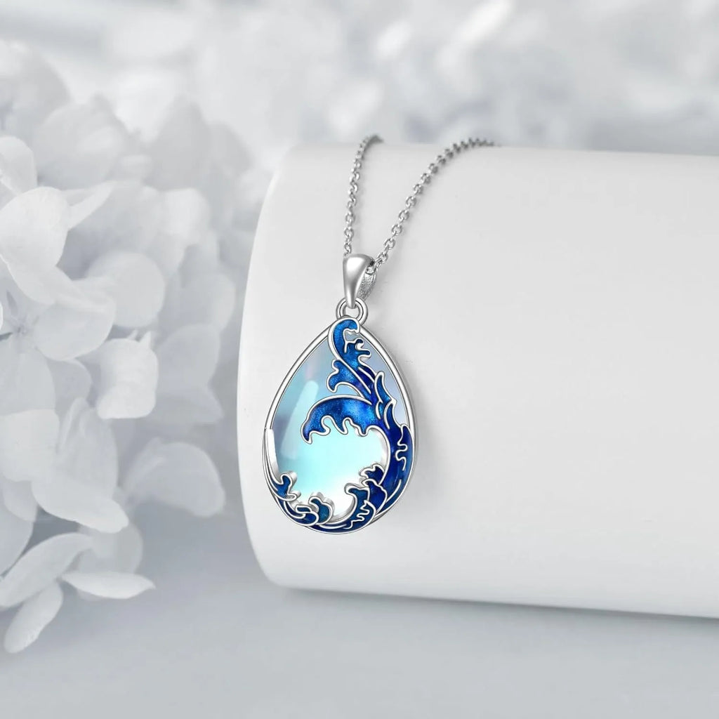 Blue moonstone pendant in a silver heart charm on an adjustable alloy necklace chain.