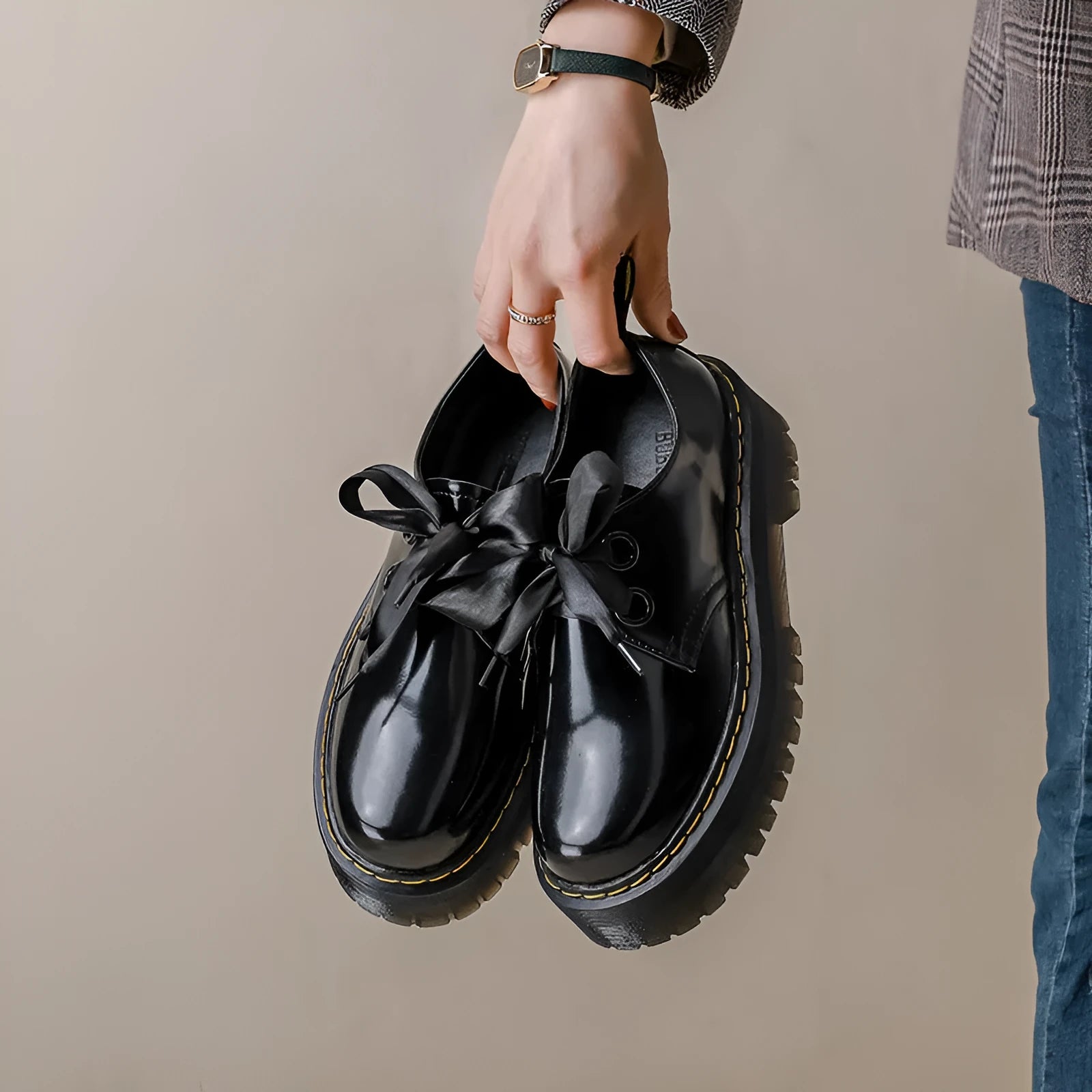 Women's thick-soled leather shoes with decorative ribbon cross-straps in black colour option