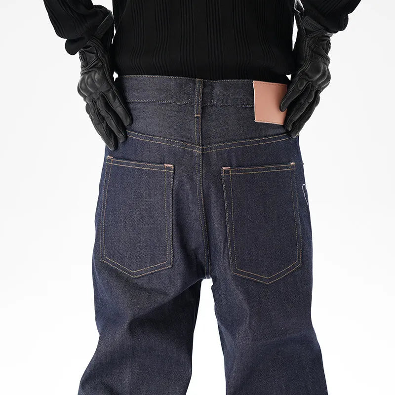A pair of dark blue loose-fit straight leg jeans on a neutral background.