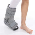 Black adjustable Achilles tendon rehabilitation boot with aluminium struts, shown on a foot.