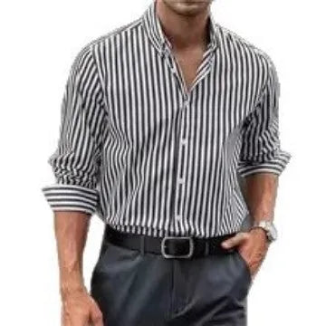 Man wearing a loose-fit khaki striped button-down cardigan-style shirt.
