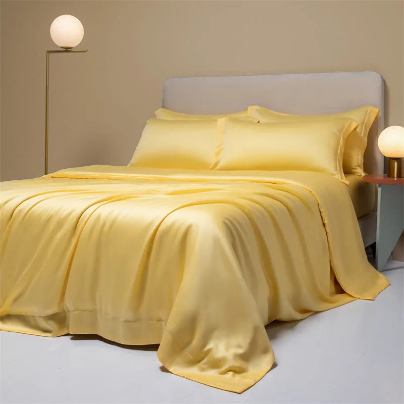 200 thread count Lenzing Tencel quilt cover and sheet set in Aurora Blue, laid on a bed.