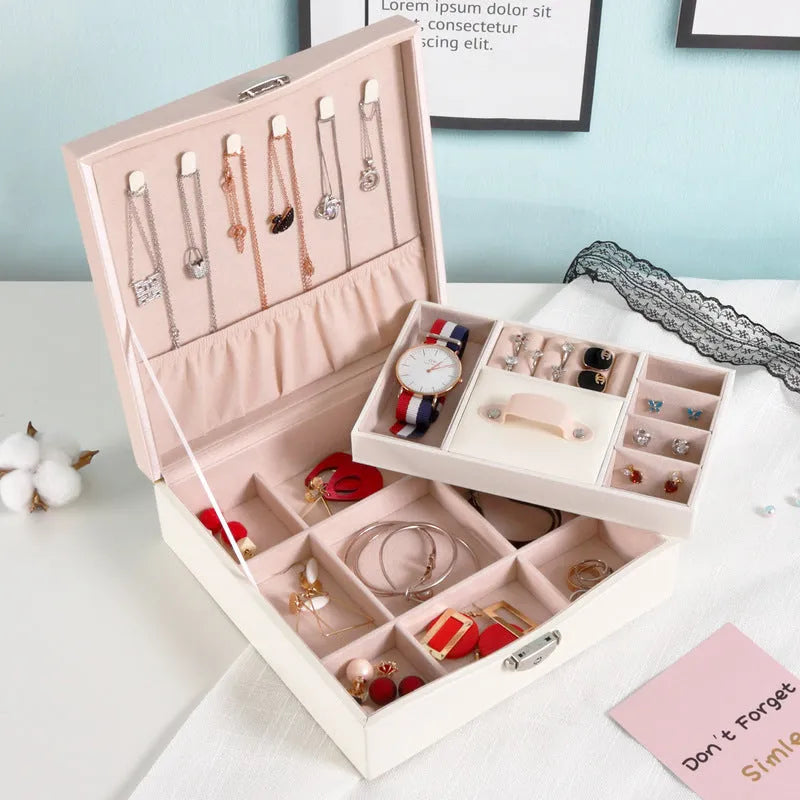 Red PU leather jewellery storage box for necklaces and rings on a dresser