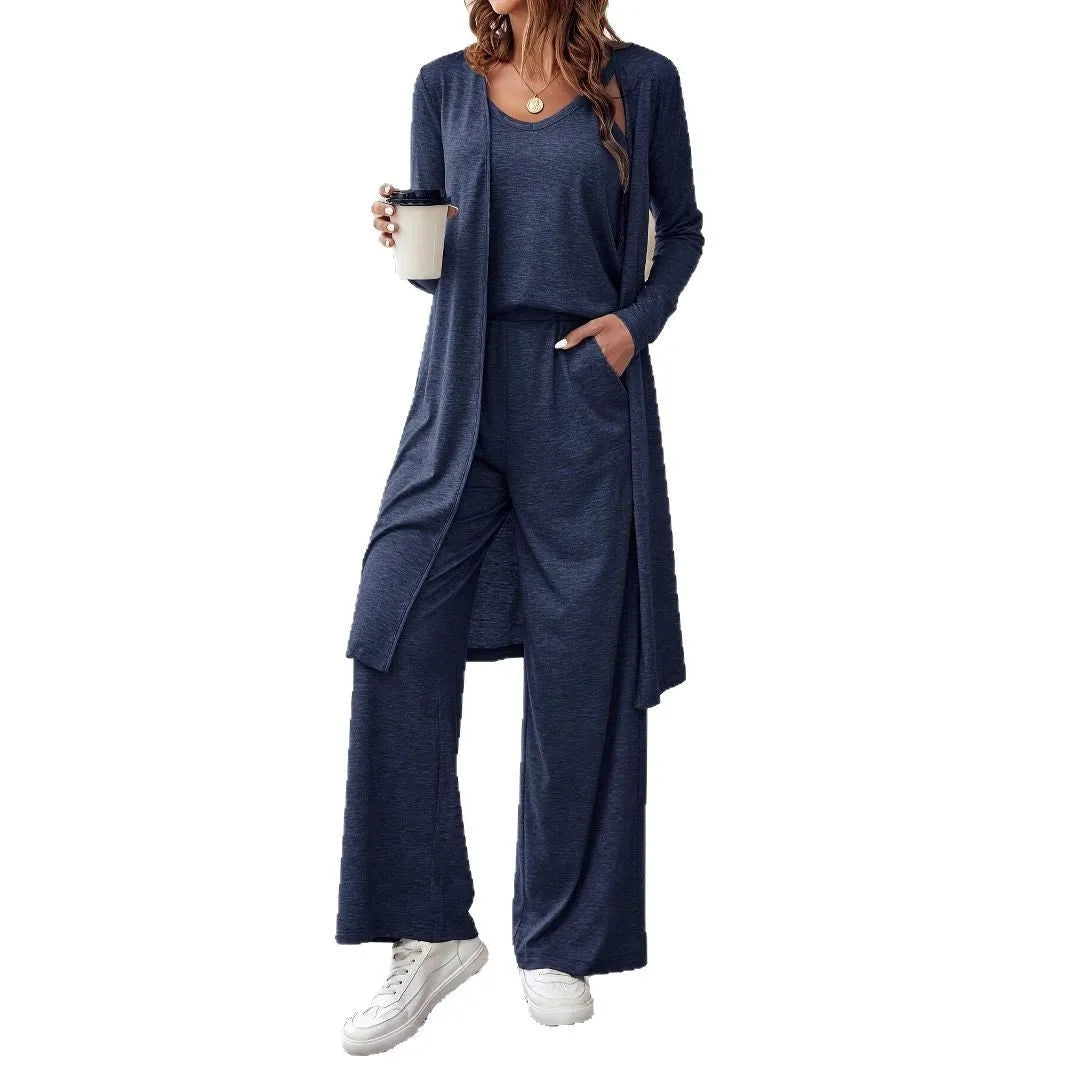 Blue women's three-piece casual suit set with sling top, cardigan, trousers, and suspenders on a hanger.