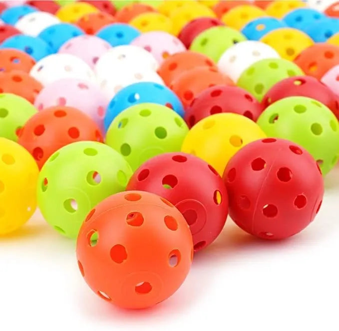 Multi-colour golf practice balls with a 26-hole target mat, stored in a net pocket.