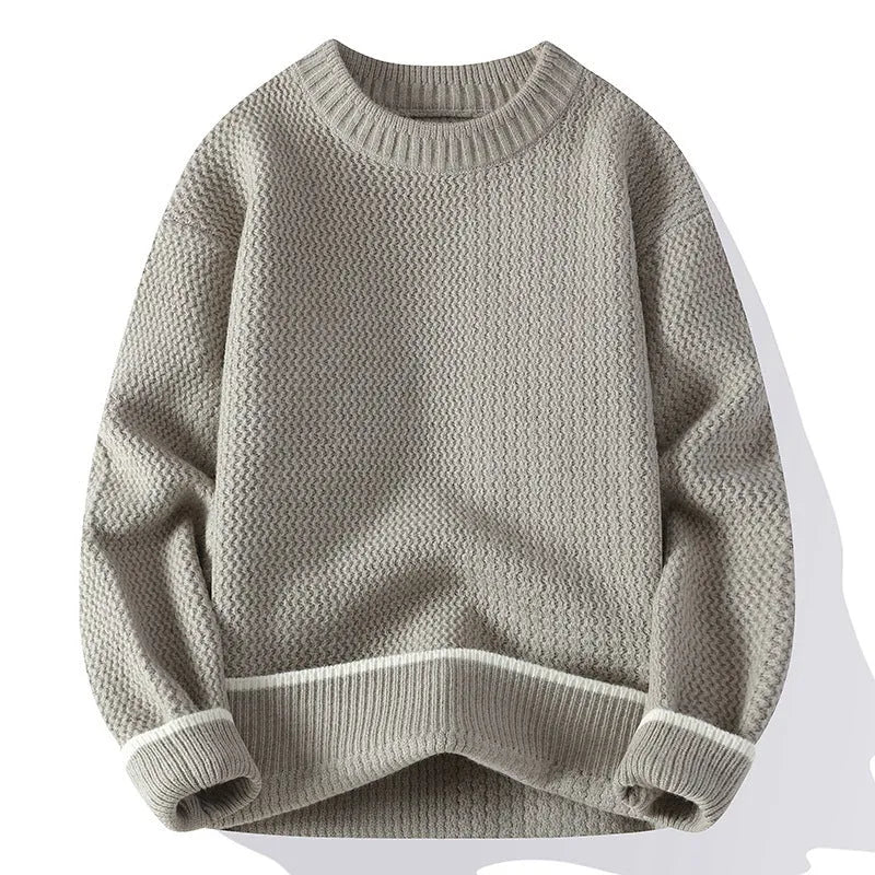 A grey men's loose-fit round neck long sleeve pullover sweater on a hanger.