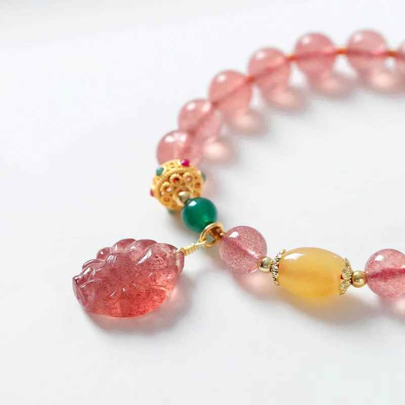 Women's crystal bracelet with strawberry quartz beads in nine tail fox design