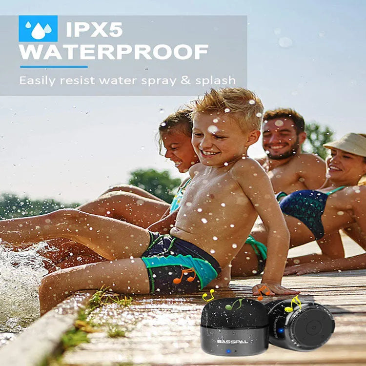 Black portable mini Bluetooth speaker with plastic shell and button controls.