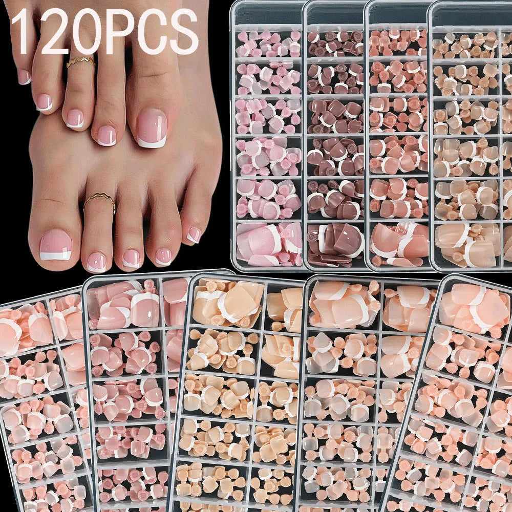 120 piece set of nude French white tip artificial toenails in nine shades, showing square short shape.