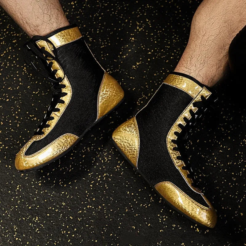 Professional black and gold mesh boxing shoe for indoor wrestling and training.