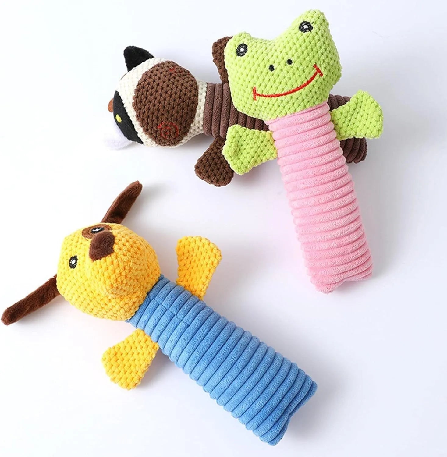 Soft cloth and polyester fibre squeaky stuffed dog chew toy, shown in calf, frog, or puppy shape, measuring 19cm long.