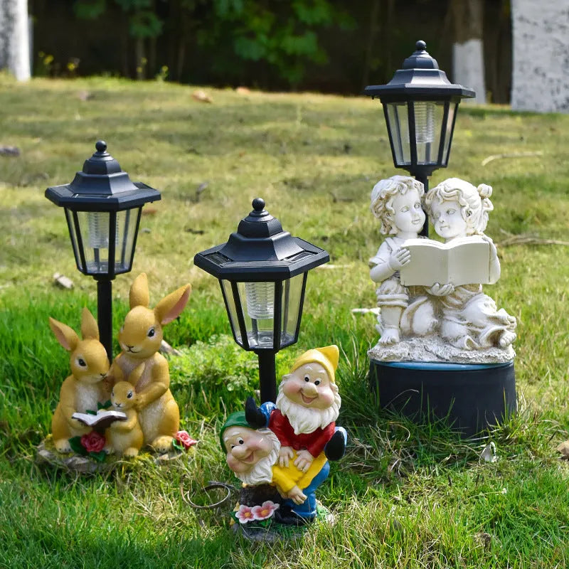 Hexagonal solar garden lamp with animal sculpture decoration in outdoor setting