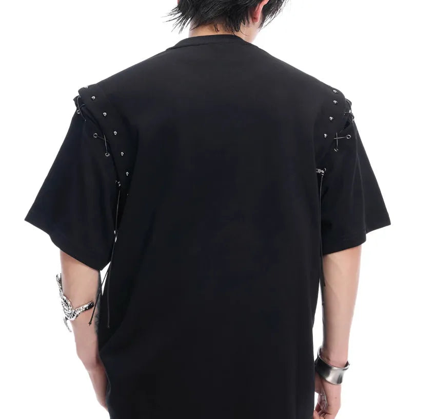 Deconstruction style short sleeve T-shirt with lace-up sides and cutout details in black or white.