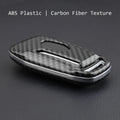 Plastic remote control protective shell for car keys with a buckle closure.