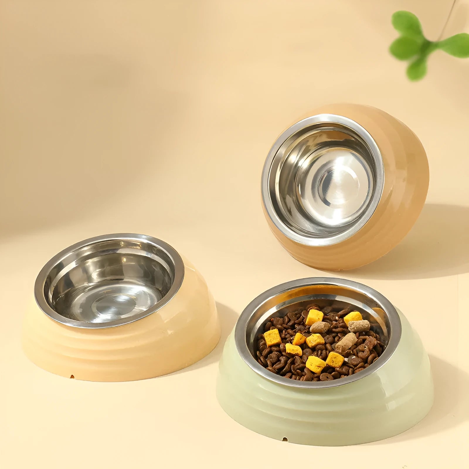 Stainless steel cat bowl with weighted plastic base in choice of beige, brown, or light green