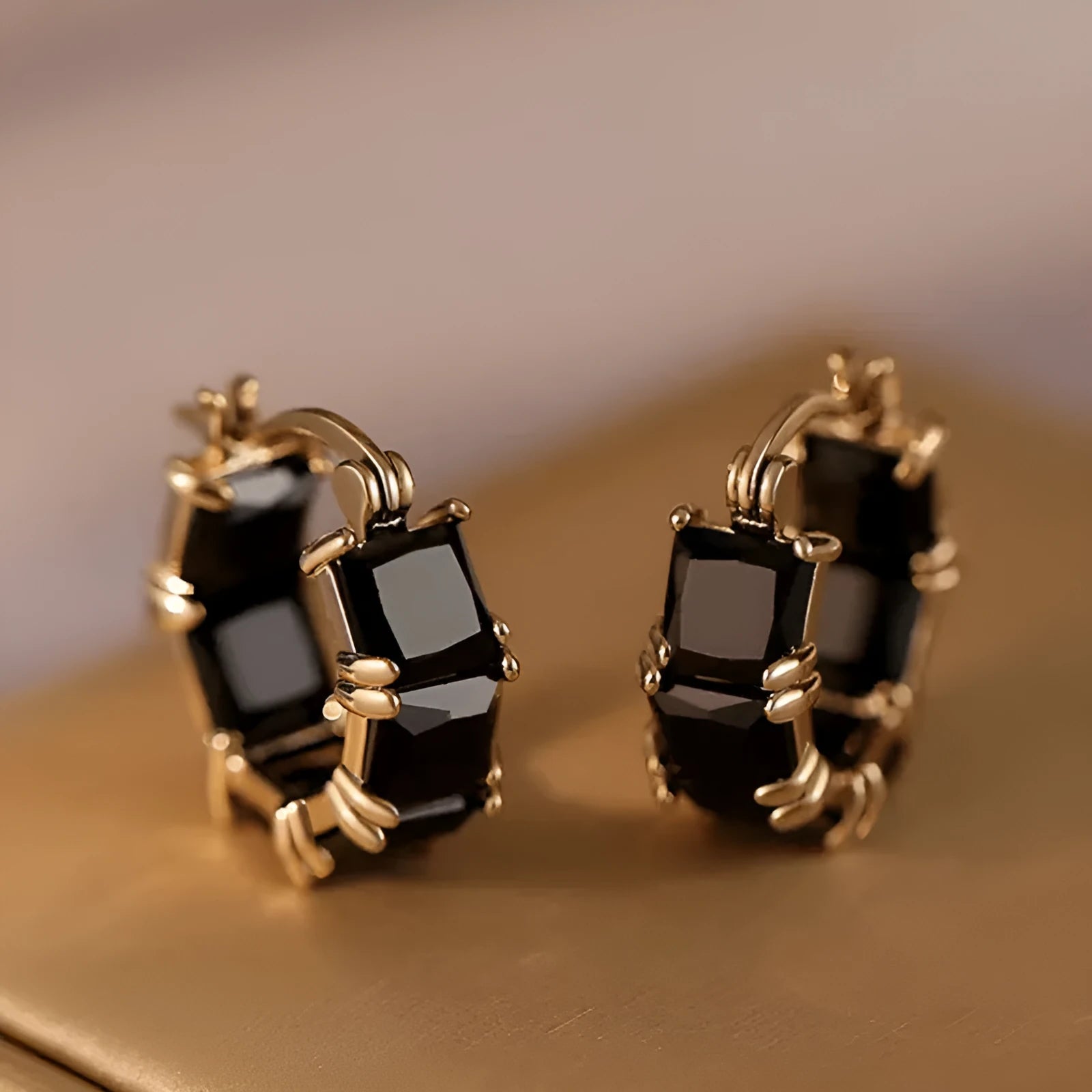 Geometric U-shaped drop earrings with zircon stones in black, pink or white colours on gold electroplated copper