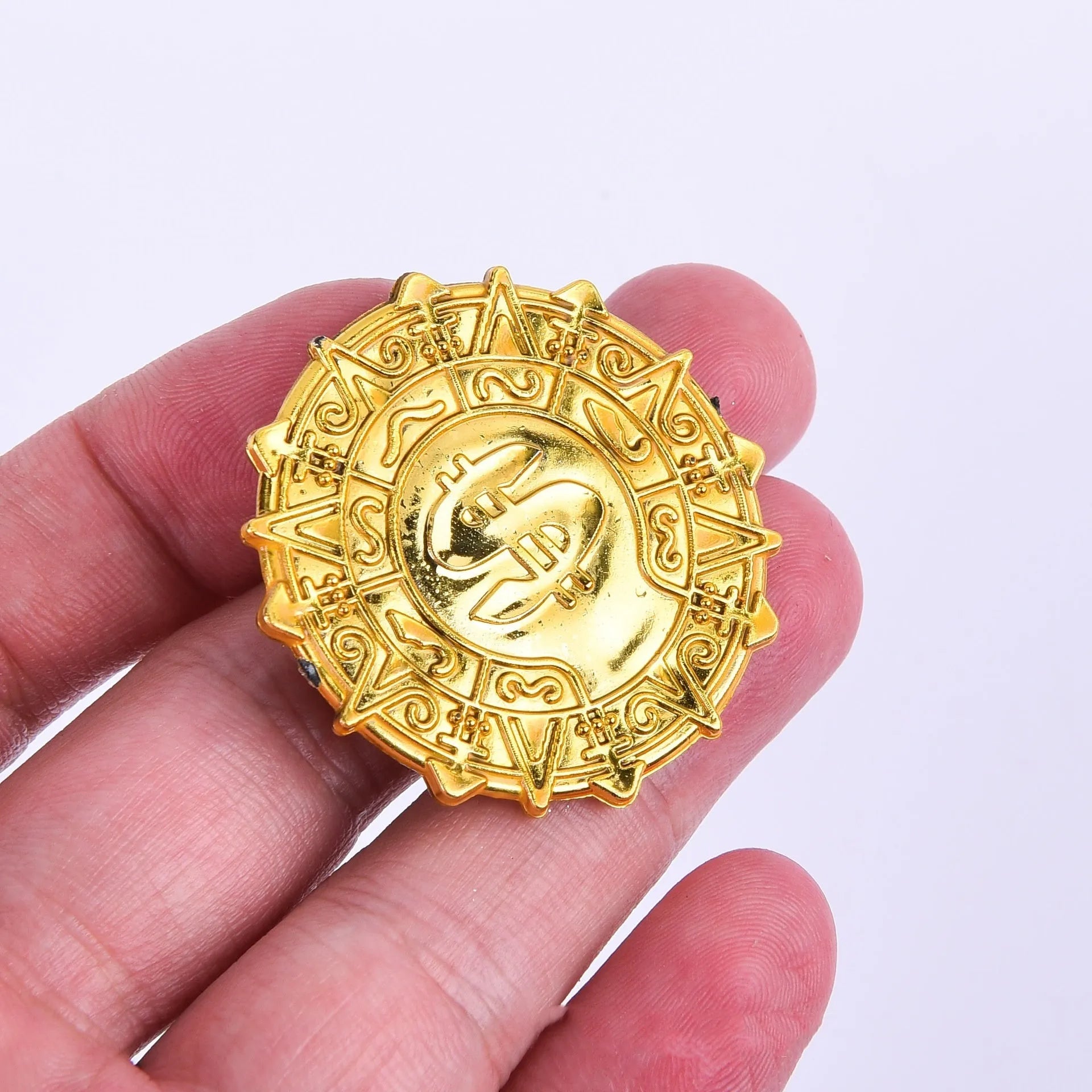 Plastic pirate gold coin toy with pointed tip design measuring 3.6cm diameter
