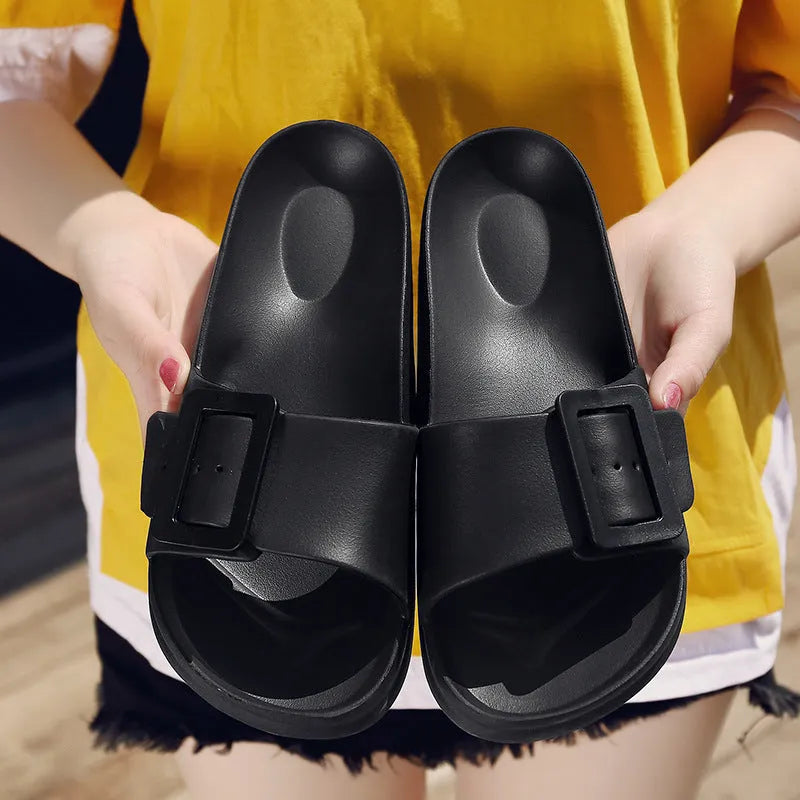 Women's grey blue flip-flop sandals with a buckle strap and soft EVA sole.